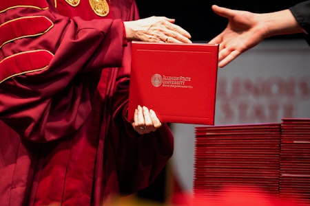 A degree being handed out.
